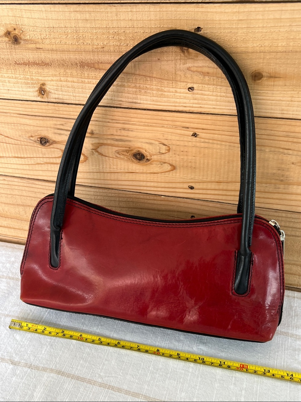 Sleek Red Shoulder Bag with Black Handles